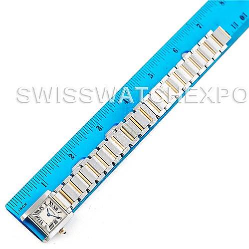 The image shows a Cartier Tank Francaise W51007Q4 Women's Steel and Gold (two tone) Silver Dial W51007Q4 Women's Steel and Gold (two tone) Silver Dial watch laid flat alongside a blue ruler for measurement.