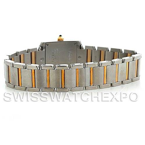 The image shows the back and bracelet of a Cartier Tank Française watch, focusing on its bicolor metallic design.