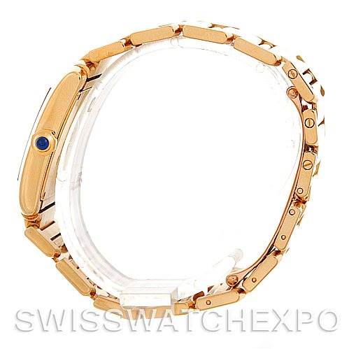 This image shows a side profile of the Tank Française model by Cartier, highlighting its gold case and bracelet.