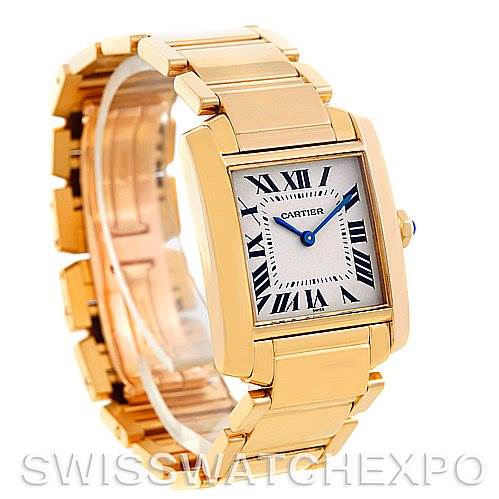 This image shows a Cartier Tank Francaise W50003N2 Women's Yellow Gold Silver Dial W50003N2 Women's Yellow Gold Silver Dial watch from a front angle, highlighting its gold casing, bracelet, and rectangular dial with Roman numerals.