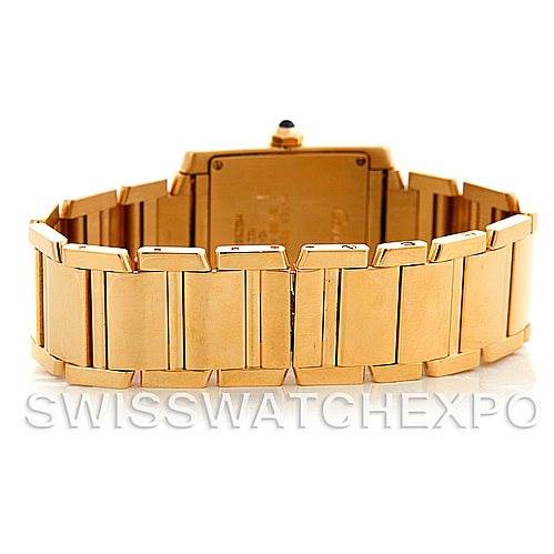 The image shows the back view of a Cartier Tank Francaise W50003N2 Women's Yellow Gold Silver Dial W50003N2 Women's Yellow Gold Silver Dial watch, highlighting its gold bracelet and clasp.