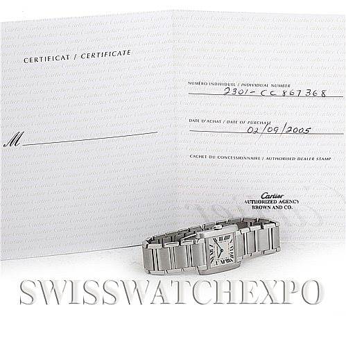 This image shows a Cartier Tank Francaise Women's Stainless Steel Silver Dial Women's Stainless Steel Silver Dial watch laid flat, accompanied by its certificate of authenticity.