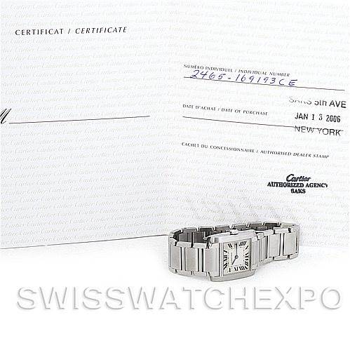 The image shows a Cartier Tank Française watch placed in front of a certificate of purchase.