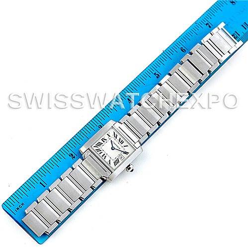 The image shows a Tank Francaise model by Cartier laid flat next to a blue ruler for size reference.