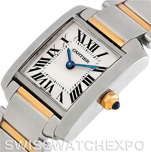 The image shows a close-up of the Cartier Tank Francaise W51007Q4 Women's Steel and Gold (two tone) Silver Dial W51007Q4 Women's Steel and Gold (two tone) Silver Dial watch, highlighting its rectangular face, Roman numerals, and metal bracelet with gold accents.
