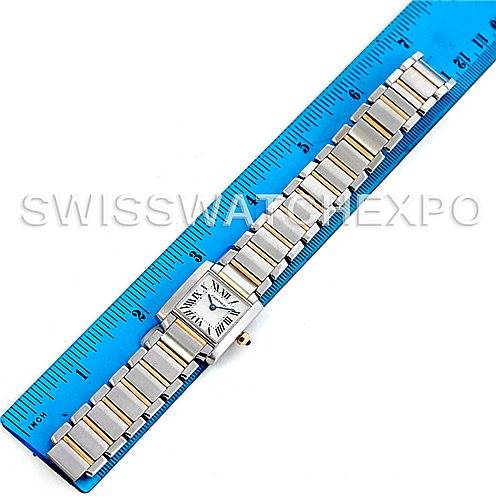 This image shows a Cartier Tank Francaise W51007Q4 Women's Steel and Gold (two tone) Silver Dial W51007Q4 Women's Steel and Gold (two tone) Silver Dial watch displayed next to a blue ruler for measurement, emphasizing the entire bracelet and face.