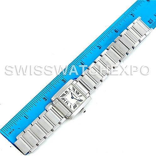 This image displays a Cartier Tank Francaise W51011Q3 Women's Stainless Steel Silver Dial W51011Q3 Women's Stainless Steel Silver Dial watch measured alongside a blue ruler, showcasing its bracelet and rectangular face.