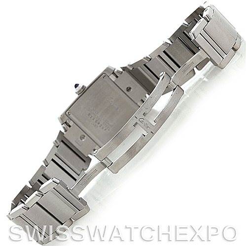 The image shows the back and bracelet of the Cartier Tank Française watch, highlighting its clasp and metal links.