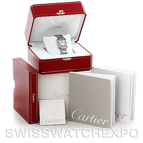 This Tank Francaise watch by Cartier is displayed in an open red box with additional branded booklets and boxes around it.