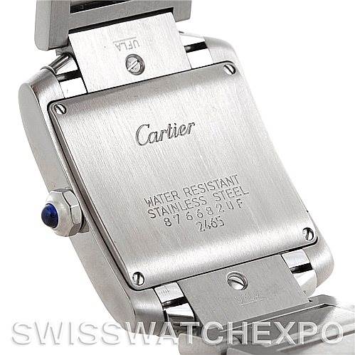 This image shows the back case of a Cartier Tank Française watch, highlighting its stainless steel construction and inscriptions.