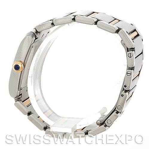 The image shows a Cartier Tank Francaise W51012Q4 Women's Steel and Gold (two tone) Silver Dial W51012Q4 Women's Steel and Gold (two tone) Silver Dial watch from a side angle, highlighting the bracelet and the crown with a blue cabochon.