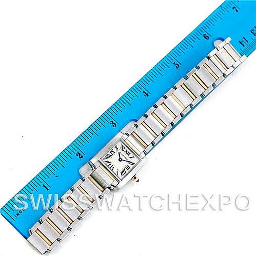 The Cartier Tank Francaise W51007Q4 Women's Steel and Gold (two tone) Silver Dial W51007Q4 Women's Steel and Gold (two tone) Silver Dial watch is shown laid flat next to a ruler, showcasing its entire band and square face.