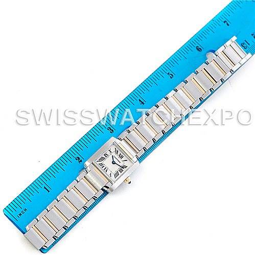 The image shows a Cartier Tank Francaise W51007Q4 Women's Steel and Gold (two tone) Silver Dial W51007Q4 Women's Steel and Gold (two tone) Silver Dial watch placed alongside a blue ruler, displaying the watch face and full metal bracelet.