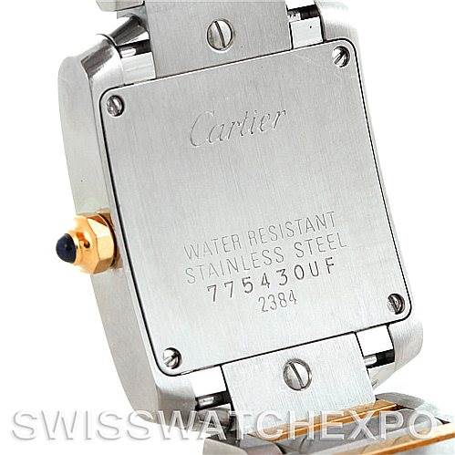 This image shows the back case of a Cartier Tank Francaise W51007Q4 Women's Steel and Gold (two tone) Silver Dial W51007Q4 Women's Steel and Gold (two tone) Silver Dial watch, highlighting the screws, markings, and part of the bracelet.