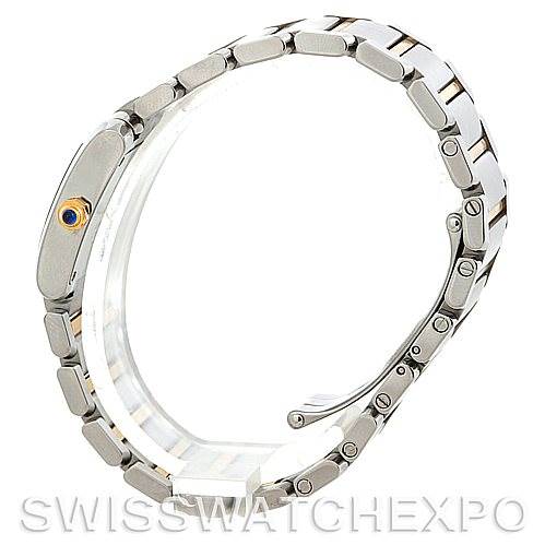 This image shows a side view of the Cartier Tank Française watch, highlighting its bracelet and crown with a blue gem.