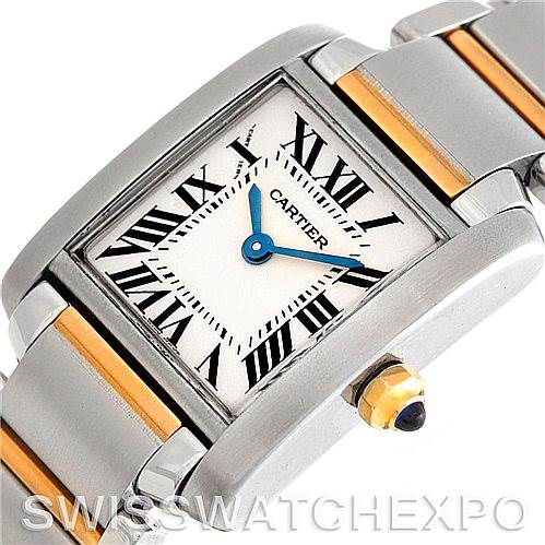 The image shows a close-up angle of the Tank Francaise model by Cartier, highlighting the rectangular face, Roman numeral markers, and gold-accented bracelet.