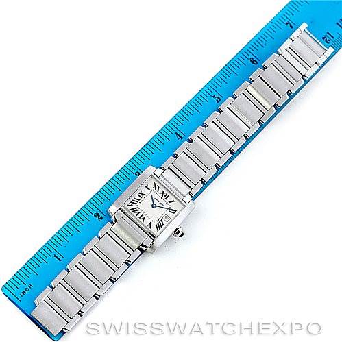 The Cartier Tank Francaise W51011Q3 Women's Stainless Steel Silver Dial W51011Q3 Women's Stainless Steel Silver Dial watch is shown from a top-down angle, displaying the entire band and watch face next to a blue ruler.