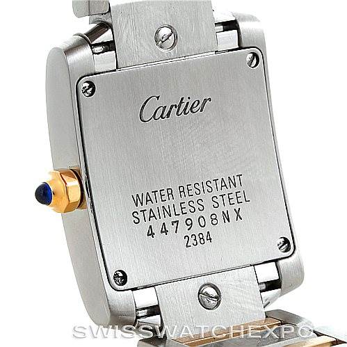 This image shows the back case of a Tank Francaise model by Cartier, revealing text details and part of the bracelet.