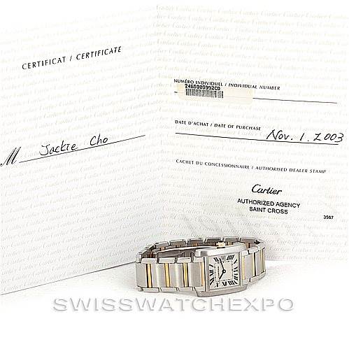 The image shows a Cartier Tank Française watch and its certificates of authenticity and purchase, captured from a front angle.