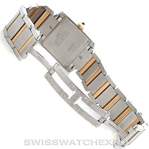 The image shows the back and clasp of a Cartier Tank Française watch, highlighting the metal and gold-tone bracelet.