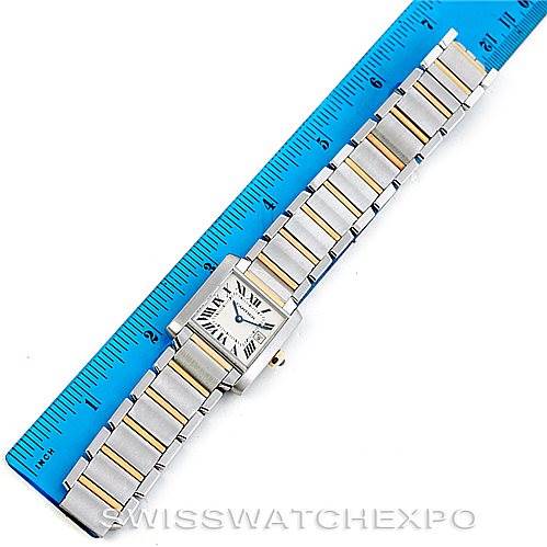 The image shows a Cartier Tank Française watch placed next to a ruler, displaying the face and full length of the bracelet.