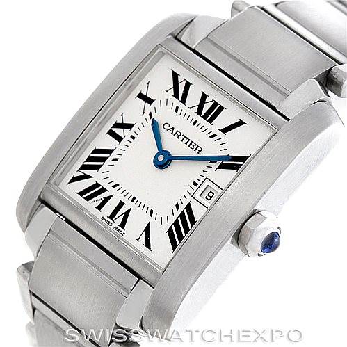 This Cartier Tank Francaise W51011Q3 Women's Stainless Steel Silver Dial W51011Q3 Women's Stainless Steel Silver Dial watch is photographed at an angle showcasing its face, crown with a blue gem, and metal bracelet.