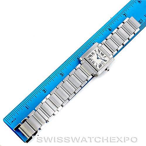This image shows a Cartier Tank Francaise W51011Q3 Women's Stainless Steel Silver Dial W51011Q3 Women's Stainless Steel Silver Dial watch laid flat next to a blue ruler for scale.