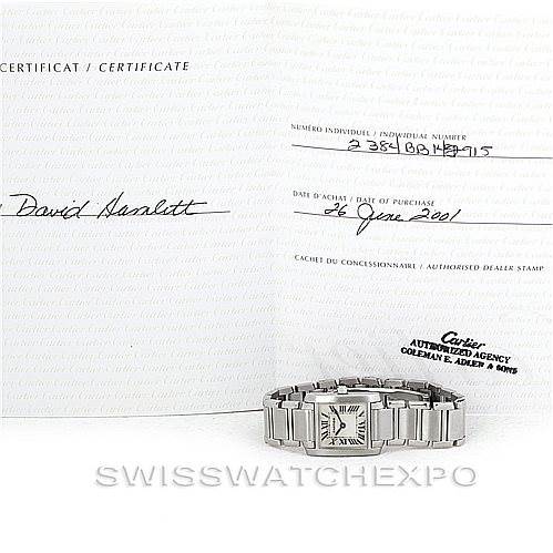 The image shows a Cartier Tank Francaise W51008Q3 Women's Stainless Steel Silver Dial W51008Q3 Women's Stainless Steel Silver Dial watch resting on an open certificate of authenticity.
