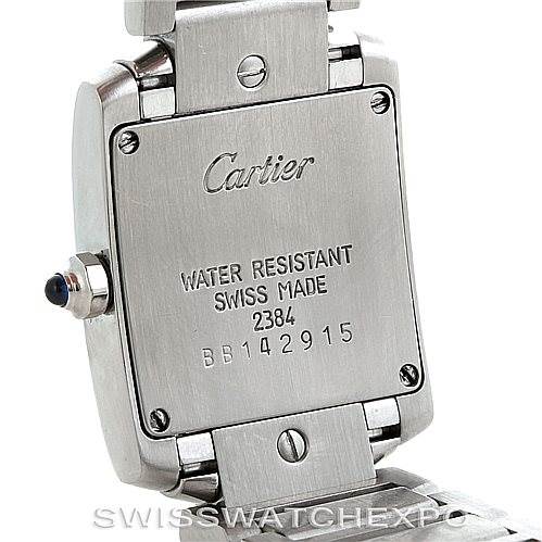 The image shows the backside of a Cartier Tank Française watch, highlighting the model's water resistance and serial number.
