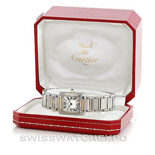 The image shows a Cartier Tank Française watch positioned at a slight angle inside a red Cartier presentation box.