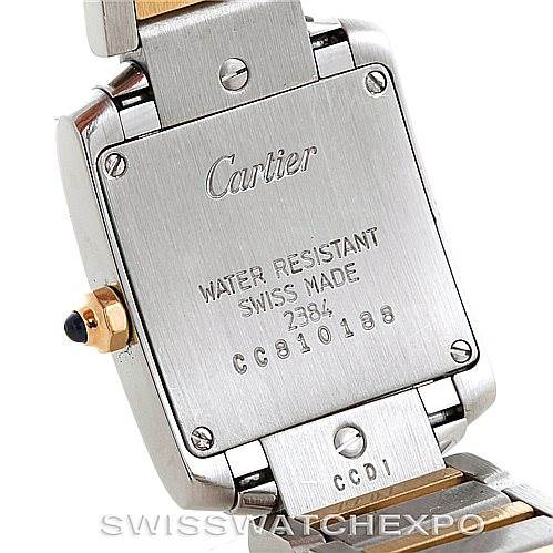 The image shows the back case and part of the bracelet of the Cartier Tank Francaise W51007Q4 Steel and Gold (two tone) Silver Dial W51007Q4 Steel and Gold (two tone) Silver Dial watch, featuring engraved details and a crown side view.