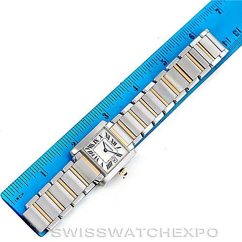 This image shows a full-length view of a Cartier Tank Francaise W51012Q4 Women's Steel and Gold (two tone) Silver Dial W51012Q4 Women's Steel and Gold (two tone) Silver Dial watch, laid flat next to a blue ruler.