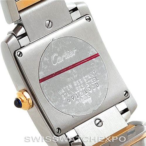 This image shows the back case of a Cartier Tank Francaise W51012Q4 Women's Steel and Gold (two tone) Silver Dial W51012Q4 Women's Steel and Gold (two tone) Silver Dial watch, highlighting the serial number and two-tone bracelet.