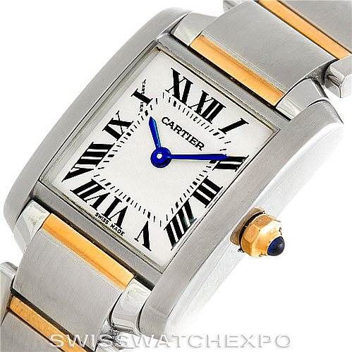 The image shows a close-up of the Cartier Tank Francaise W51007Q4 Women's Steel and Gold (two tone) Silver Dial W51007Q4 Women's Steel and Gold (two tone) Silver Dial watch face, crown, and part of the metal bracelet with gold accents.