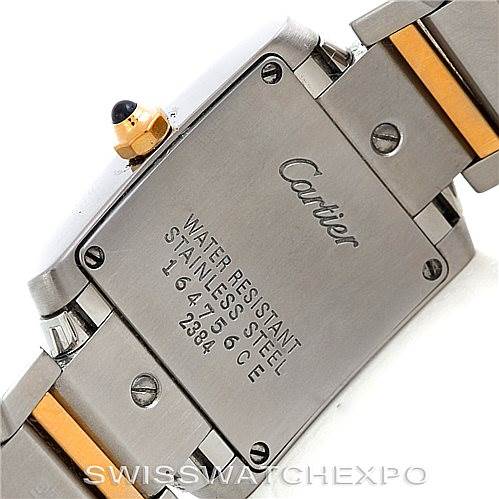 Close-up view of the back casing and part of the bracelet of a Cartier Tank Francaise W51007Q4 Women's Steel and Gold (two tone) Silver Dial W51007Q4 Women's Steel and Gold (two tone) Silver Dial watch, showing the brand engraving and water resistance details.