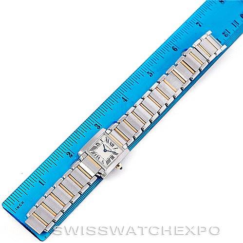 The Cartier Tank Francaise W51007Q4 Women's Steel and Gold (two tone) Silver Dial W51007Q4 Women's Steel and Gold (two tone) Silver Dial watch is shown from an aerial view alongside a blue ruler for size reference.