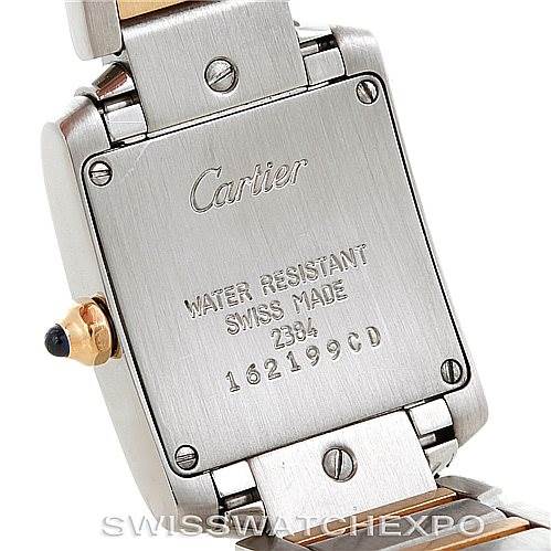 This image shows the back case of a Tank Française watch by Cartier, including parts of the watch band and clasp.