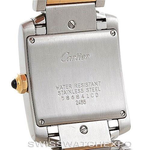 The image shows the back case of a Cartier Tank Francaise W51012Q4 Women's Steel and Gold (two tone) Silver Dial W51012Q4 Women's Steel and Gold (two tone) Silver Dial watch, highlighting the details engraved on it.