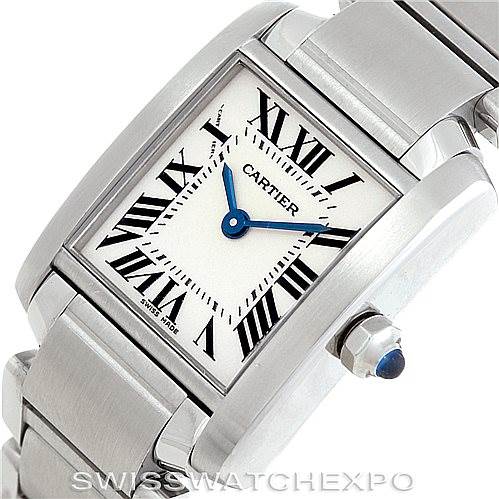 The image shows a Cartier Tank Francaise W51008Q3 Women's Stainless Steel Silver Dial W51008Q3 Women's Stainless Steel Silver Dial watch at an angled close-up, displaying the face, bracelet, and crown with a blue cabochon.
