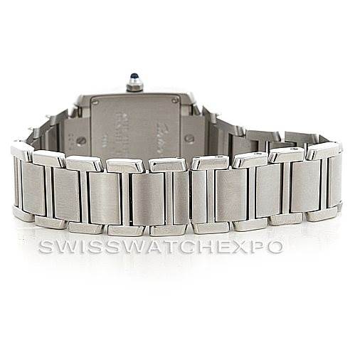 The image shows the back and bracelet of a Cartier Tank Française watch, highlighting the stainless steel links and case back.