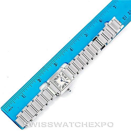 The image shows a top-down view of a Cartier Tank Francaise W51008Q3 Women's Stainless Steel Silver Dial W51008Q3 Women's Stainless Steel Silver Dial watch laid flat next to a blue ruler for size reference.