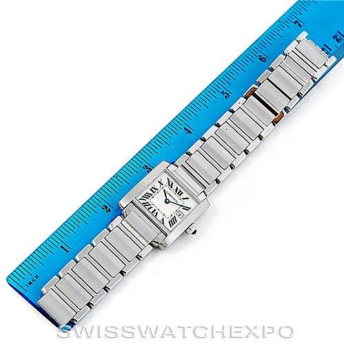 The Cartier Tank Francaise W51011Q3 Women's Stainless Steel Silver Dial W51011Q3 Women's Stainless Steel Silver Dial watch is shown from a top-down angle, highlighting its face and metal bracelet alongside a blue ruler for scale.