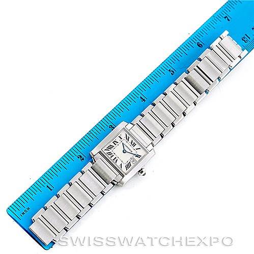 The image shows a Cartier Tank Francaise W51011Q3 Women's Stainless Steel Silver Dial W51011Q3 Women's Stainless Steel Silver Dial watch placed next to a blue ruler, highlighting its full length and bracelet size.