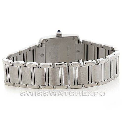 The image shows the back view of a Cartier Tank Française watch, focusing on its stainless steel bracelet and clasp.