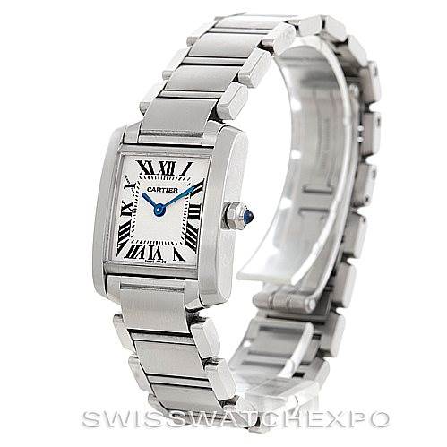 The image shows a Tank Française watch by Cartier from an angled view, highlighting the face, bracelet, and crown with a blue cabochon.