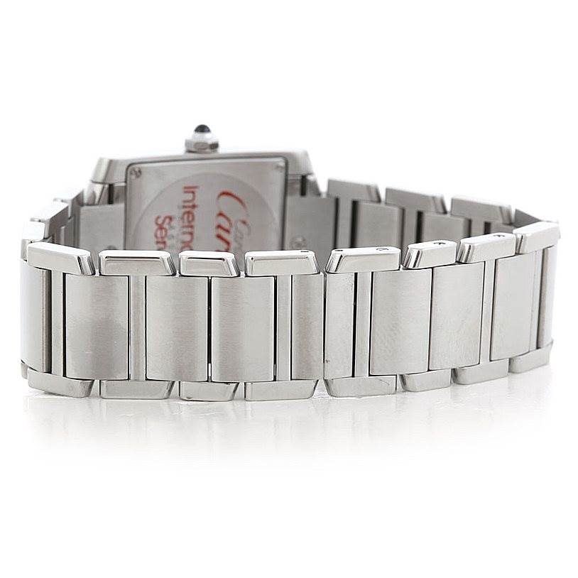 The Tank Francaise by Cartier is shown from the rear angle, highlighting its stainless steel bracelet and case back.