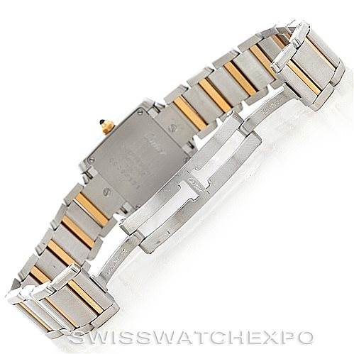 The image shows a rear angle of the Cartier Tank Française watch, focusing on its two-tone bracelet and closed stainless steel case back.