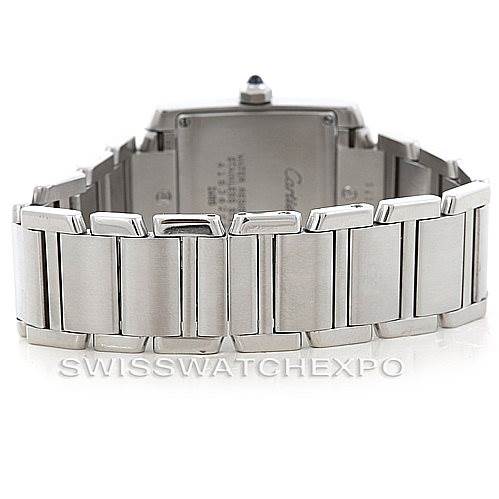 The image shows the back view of a Cartier Tank Française watch, highlighting its metal bracelet and clasp.