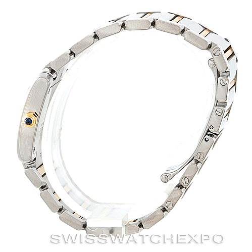 The image shows a side view of the Tank Française watch by Cartier, highlighting the bracelet and the crown.