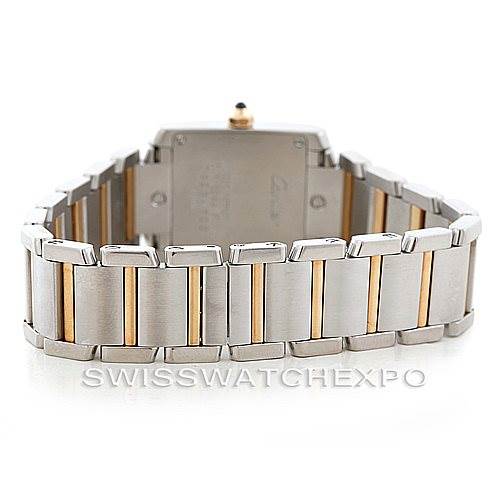 The image shows the back case and strap of a Cartier Tank Française watch, featuring a metal bracelet with gold accents.